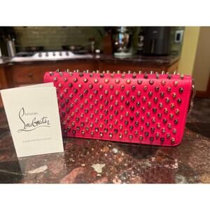 CHRISTIAN LOUBOUTIN Panettone wallet in pink with gold and silver spikes